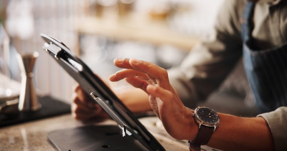 Staff member comparing insurance quotes on a tablet in Peoria, IL
