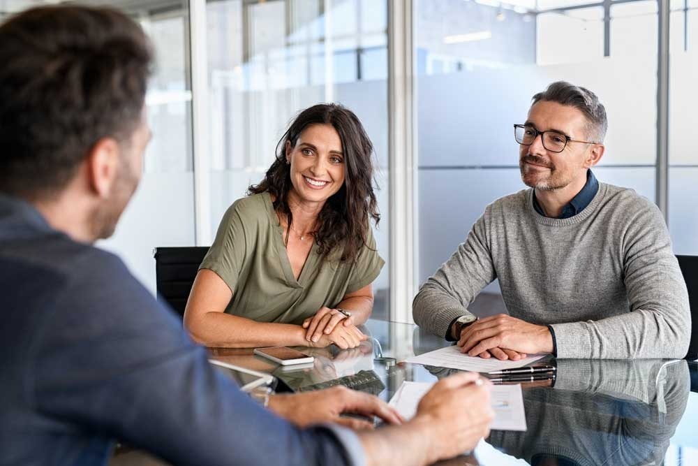 Business owners discussing commercial insurance coverage